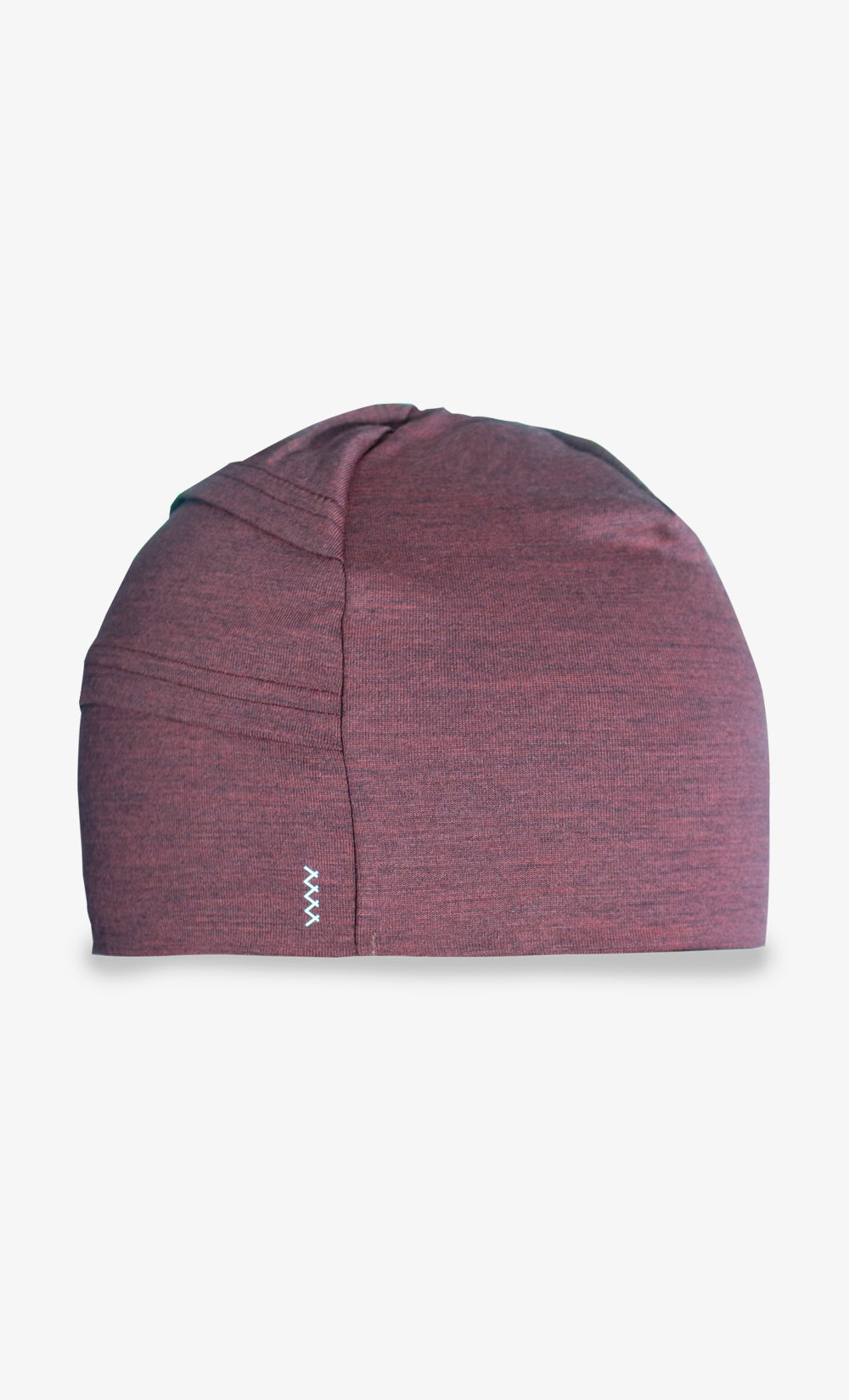 Tuque en laine mérinos légère de couleur terra rosa avec ouverture pour queue de cheval